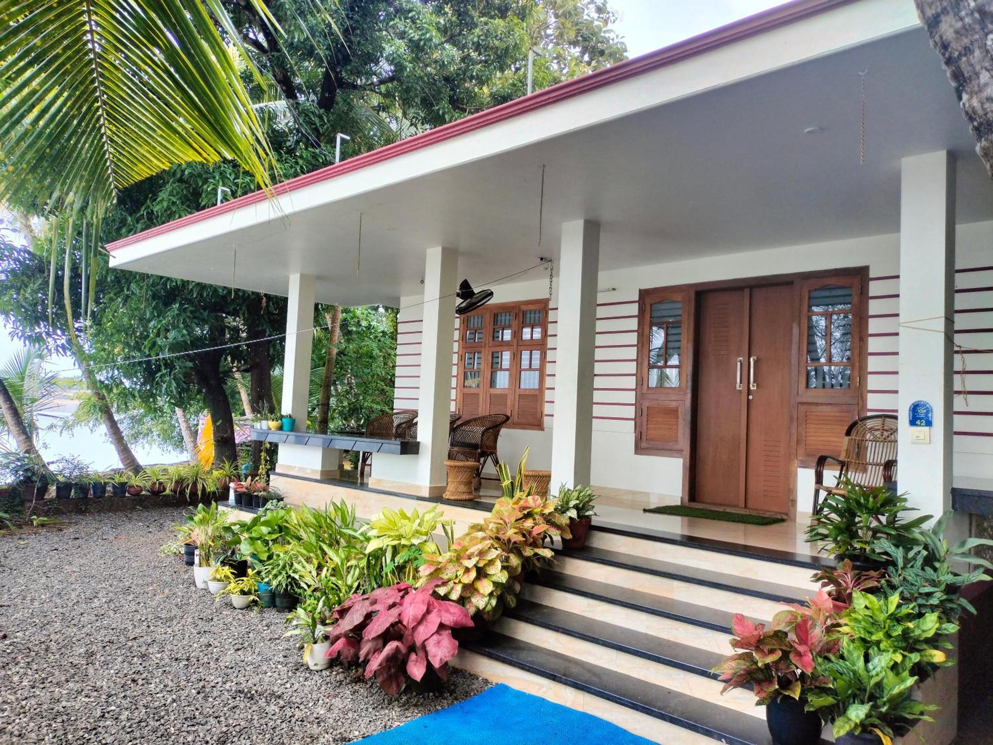 Green Island Homestay Riverside Кожикоде Экстерьер фото